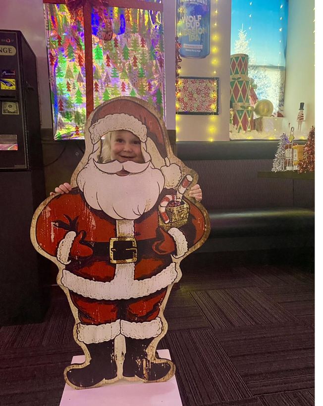 A charming vintage-style Santa cutout amid the décor