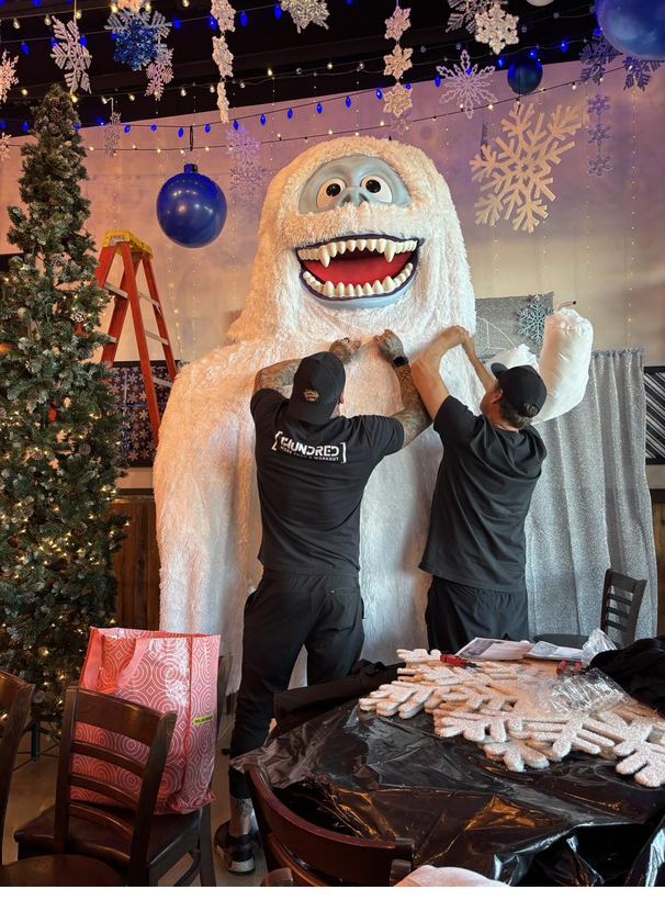 A larger-than-life Bumble snow-monster figure greeting guests