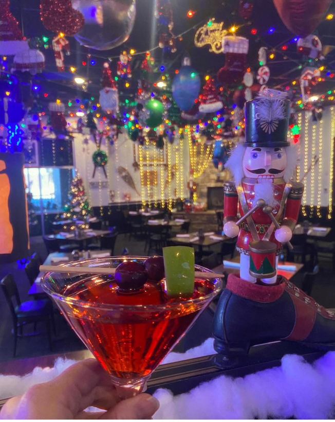 A beautifully garnished holiday cocktail on the bar